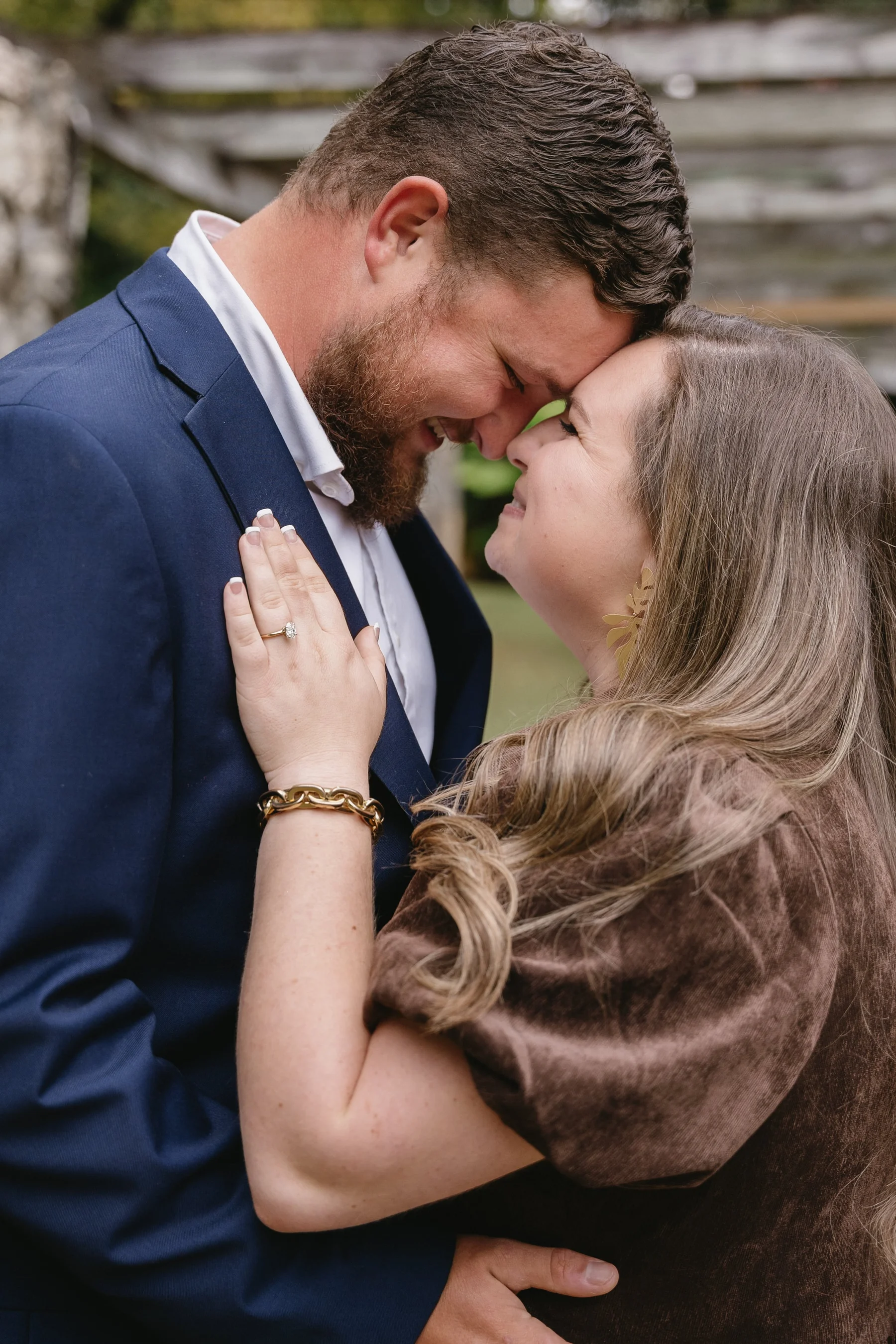 A romantic couples session — natural connection and joy captured in soft, golden light